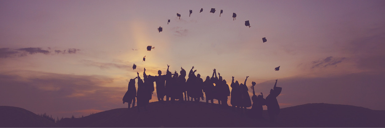 Graduates throwing caps