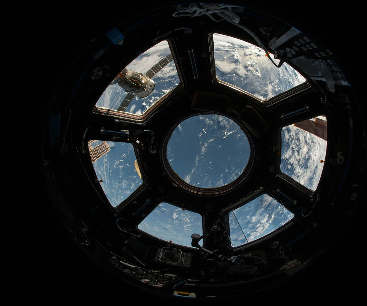 nasa shuttle window overlooking earth