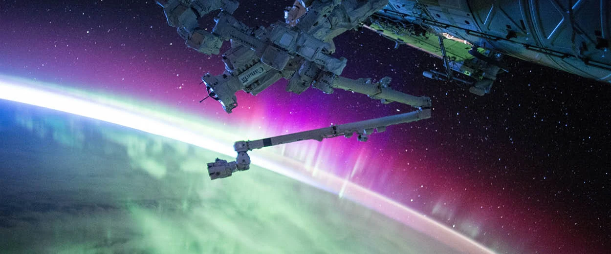 nasa satellite above aurora